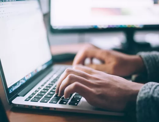 A man researching about R&D on his desk.